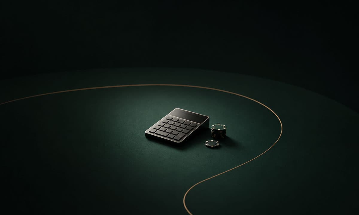 Chips and a calculator on a poker table